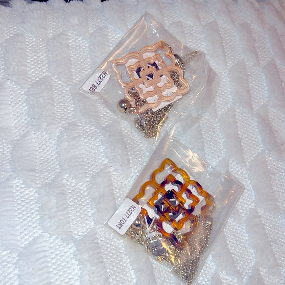 Rose shaped resin pendant and chain tassel.